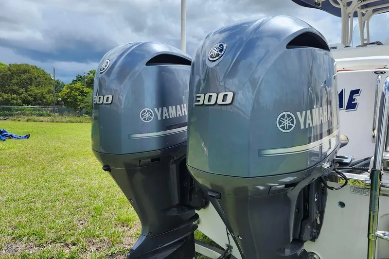 Slide: The Image of Twin Yamaha 300 outboard engines on a 2015 Robalo R300 Center Console boat. - 33