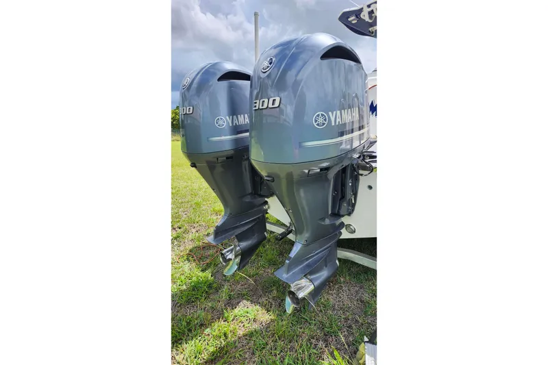 Slide: The Image of Twin Yamaha 300 outboard engines on a 2015 Robalo R300 Center Console boat. - 34