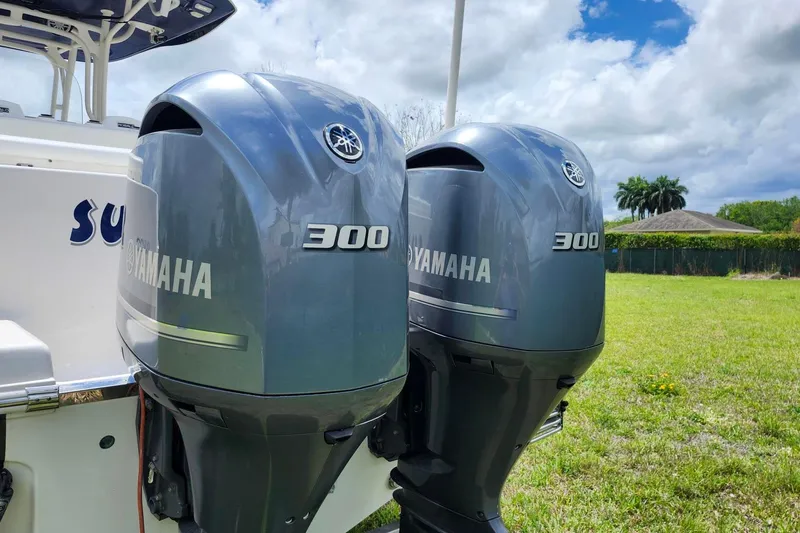 Slide: The Image of 2015 Robalo R300 Center Console with twin Yamaha 300 outboard engines. - 35