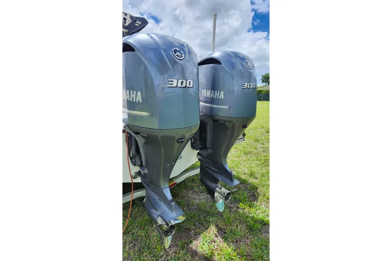 Slide: The Image of Twin Yamaha 300 outboard engines on a 2015 Robalo R300 Center Console boat. - 36