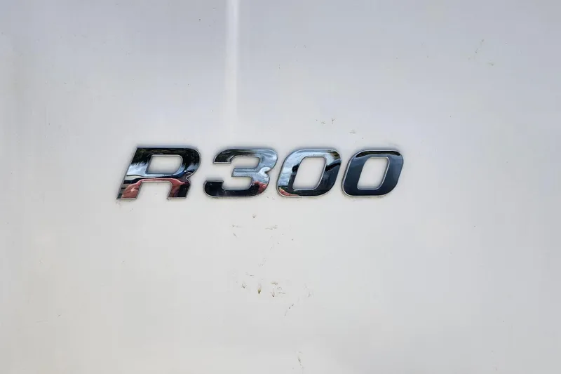 Slide: The Image of Chrome "R300" emblem on 2015 Robalo R300 Center Console boat. - 4