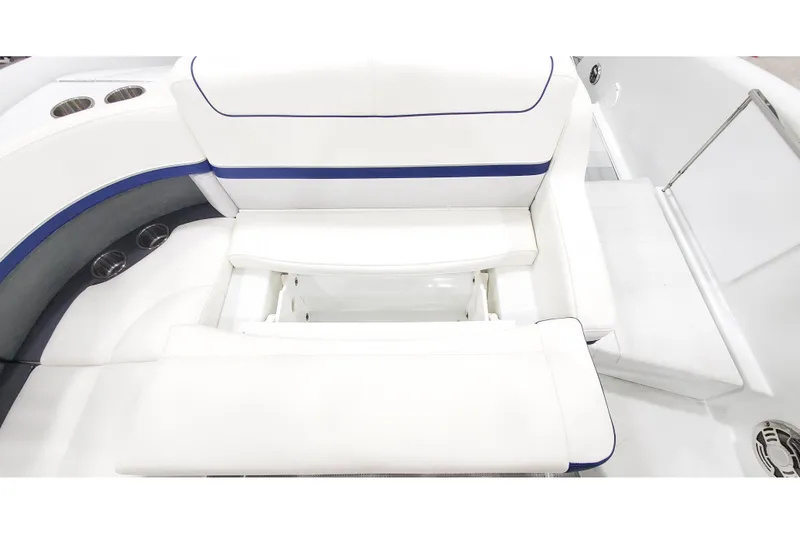 Slide: The Image of 2013 Formula 310 Bowrider interior seating with white and blue upholstery. - 10