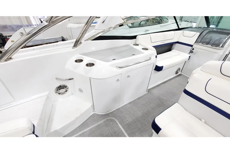 Slide: The Image of 2013 Formula 310 Bowrider interior with seating, cup holders, and sleek design. - 11
