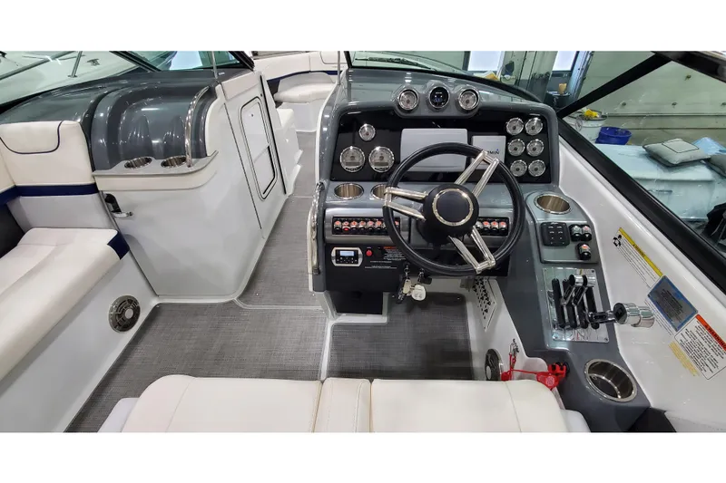 Slide: The Image of 2013 Formula 310 Bowrider cockpit with modern controls and sleek design. - 14