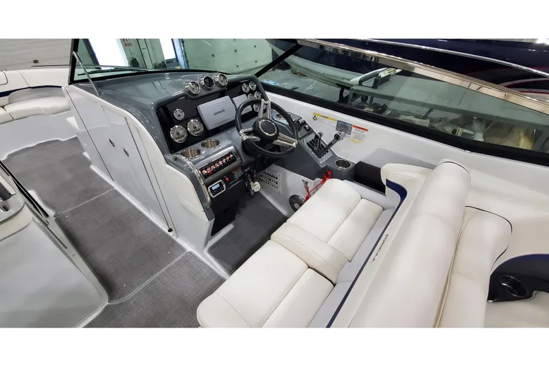 Slide: The Image of 2013 Formula 310 Bowrider cockpit with modern dashboard and plush seating. - 15