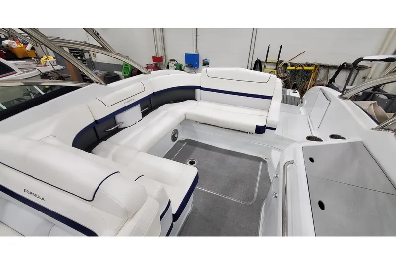 Slide: The Image of 2013 Formula 310 Bowrider interior with white seating and modern design. - 21