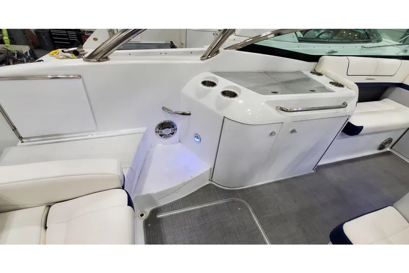Slide: The Image of 2013 Formula 310 Bowrider interior with seating and built-in cup holders. - 41