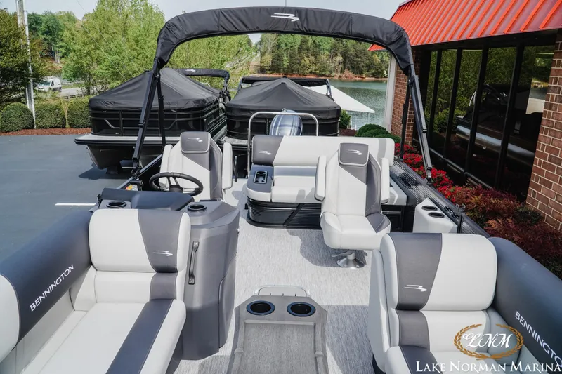 Slide: The Image of 2026 Bennington 22SSB pontoon boat with sleek seating at Lake Norman Marina. - 11