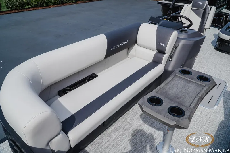 Slide: The Image of 2026 Bennington 22SSB pontoon boat interior with plush seating and cup holders. - 13