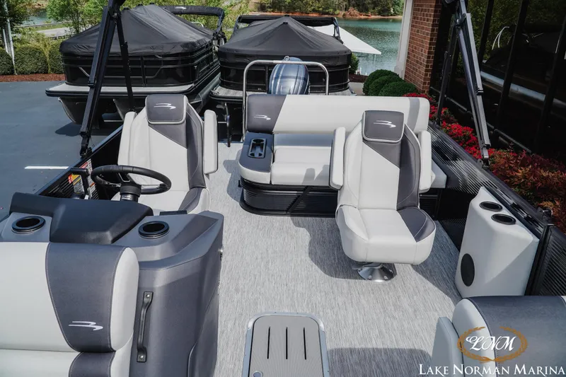 Slide: The Image of 2026 Bennington 22SSB pontoon boat interior with modern seating at Lake Norman Marina. - 15
