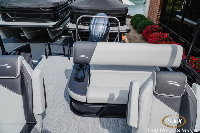 Slide: The Image of 2026 Bennington 22SSB pontoon boat interior with sleek seating at Lake Norman Marina. - 16
