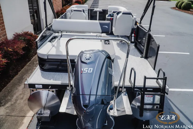 Slide: The Image of 2026 Bennington 22SSB pontoon boat with Yamaha 150 engine at Lake Norman Marina. - 4