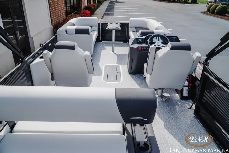 Slide: The Image of 2026 Bennington 22SSB pontoon boat interior with modern seating and steering console. - 5