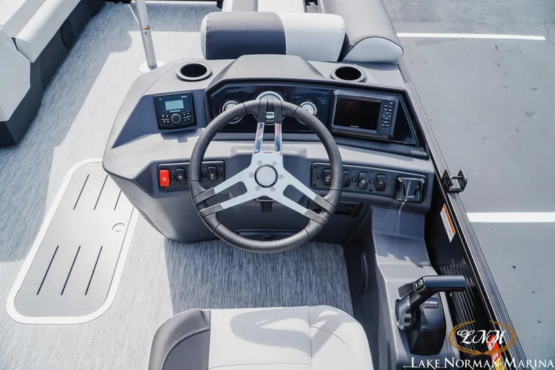 Slide: The Image of 2026 Bennington 22SSB boat dashboard with steering wheel and control panel. - 9