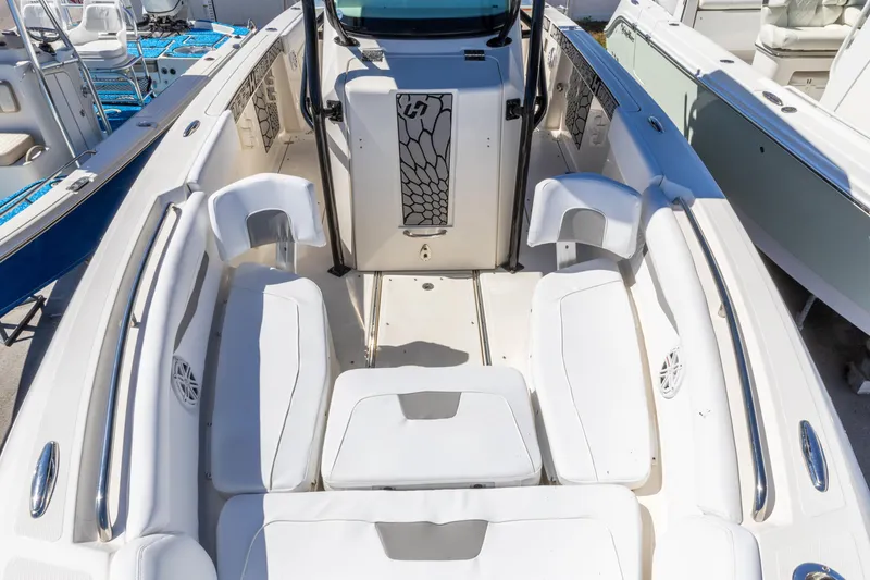 Slide: The Image of 2019 Wellcraft 262 Fisherman boat interior with white seating and sleek design. - 11