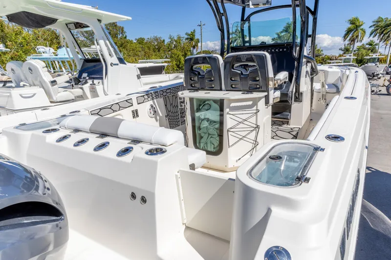 Slide: The Image of 2019 Wellcraft 262 Fisherman boat interior with seating and storage compartments. - 6