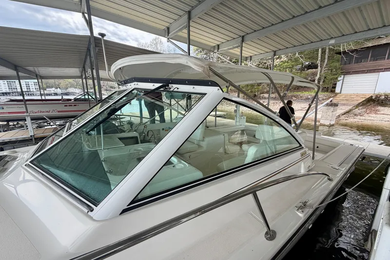 Slide: The Image of 2000 Tiara Yachts 2900 Coronet docked under covered marina. - 10