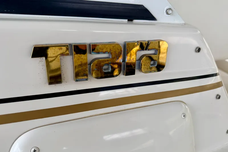 Slide: The Image of Close-up of Tiara Yachts 2900 Coronet 2000 model emblem on white surface. - 12