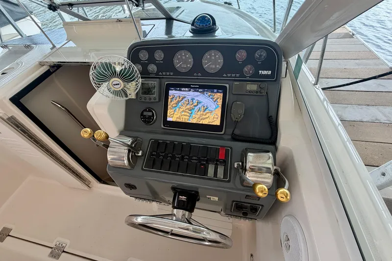 Slide: The Image of Control panel of a 2000 Tiara Yachts 2900 Coronet with navigation equipment. - 16