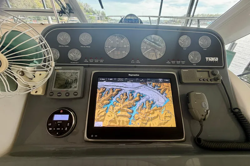Slide: The Image of Dashboard of a 2000 Tiara Yachts 2900 Coronet with navigation equipment and gauges. - 17