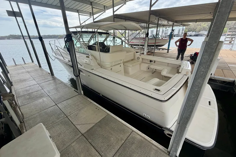 Slide: The Image of 2000 Tiara Yachts 2900 Coronet docked under a covered marina. - 2