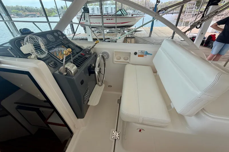 Slide: The Image of Cockpit of 2000 Tiara Yachts 2900 Coronet with steering wheel and navigation controls. - 20