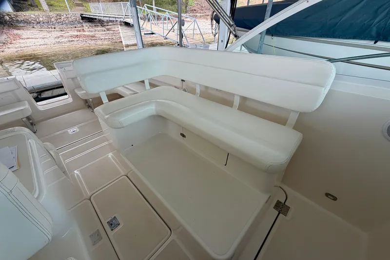 Slide: The Image of 2000 Tiara Yachts 2900 Coronet interior with white seating and spacious deck area. - 21