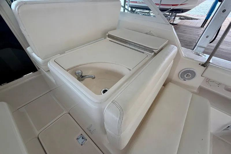 Slide: The Image of 2000 Tiara Yachts 2900 Coronet interior with sink and seating area. - 27