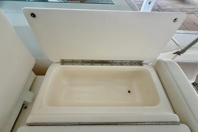 Slide: The Image of Open storage compartment on a 2000 Tiara Yachts 2900 Coronet boat. - 29