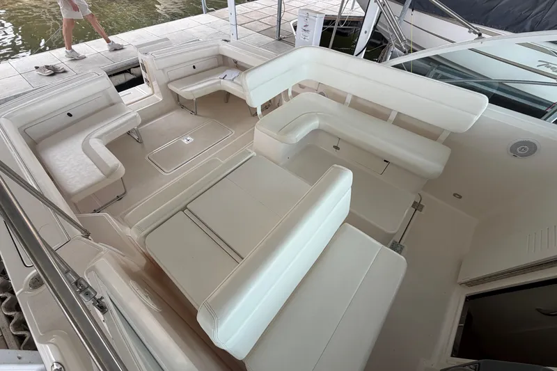 Slide: The Image of 2000 Tiara Yachts 2900 Coronet interior with white seating and spacious layout. - 32