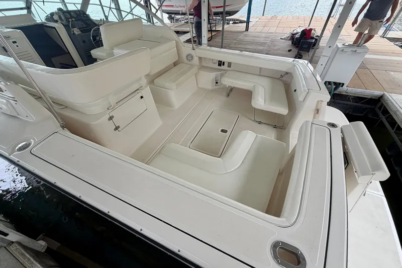 Slide: The Image of 2000 Tiara Yachts 2900 Coronet boat interior with white seating and helm. - 33