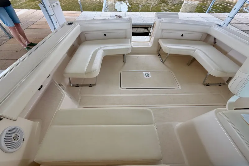 Slide: The Image of Interior of 2000 Tiara Yachts 2900 Coronet with white seating and spacious layout. - 34