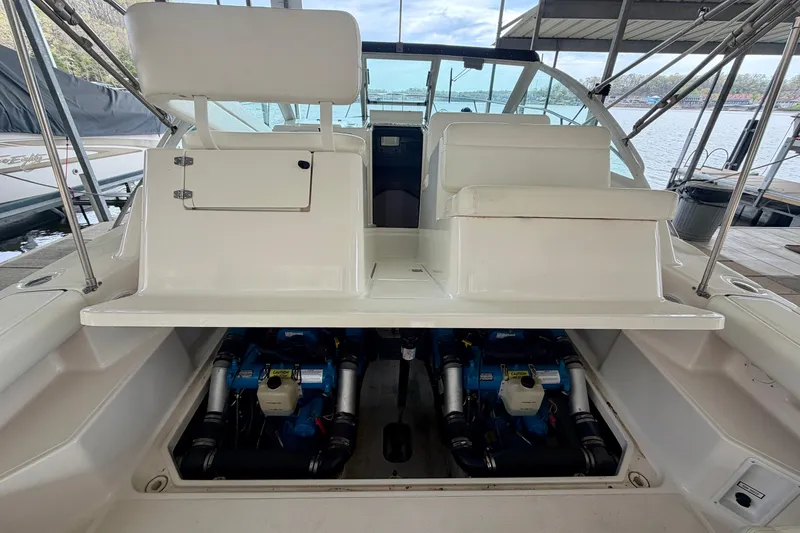 Slide: The Image of 2000 Tiara Yachts 2900 Coronet engine compartment with dual engines, docked at marina. - 35
