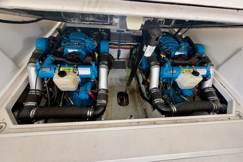 Slide: The Image of Engine compartment of a 2000 Tiara Yachts 2900 Coronet with dual blue engines. - 36