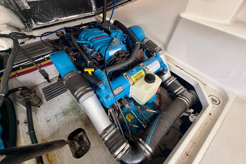 Slide: The Image of Engine compartment of a 2000 Tiara Yachts 2900 Coronet, showcasing a blue marine engine. - 37