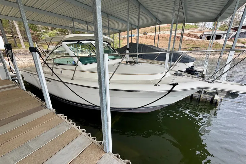 Slide: The Image of 2000 Tiara Yachts 2900 Coronet docked under a covered marina. - 4