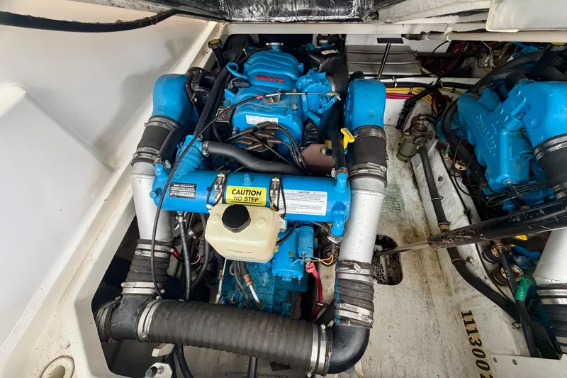 Slide: The Image of Engine compartment of a 2000 Tiara Yachts 2900 Coronet with blue engine components. - 40