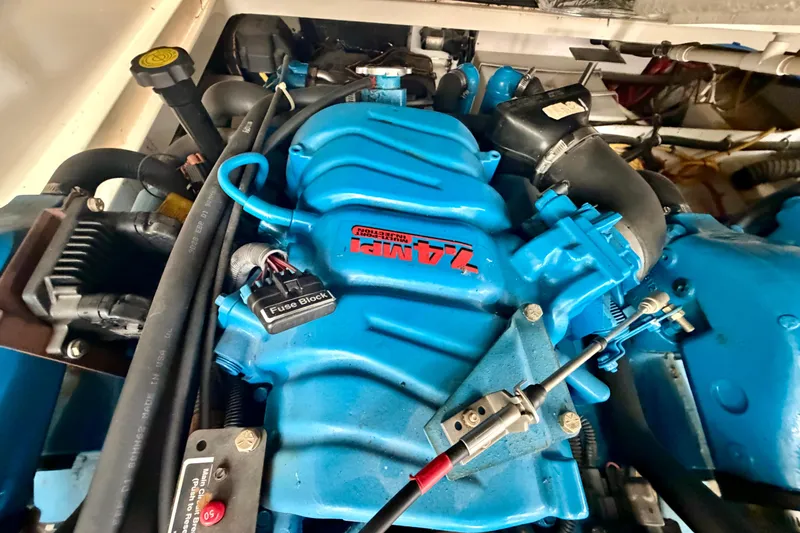 Slide: The Image of Engine compartment of a 2000 Tiara Yachts 2900 Coronet, featuring a blue engine. - 41