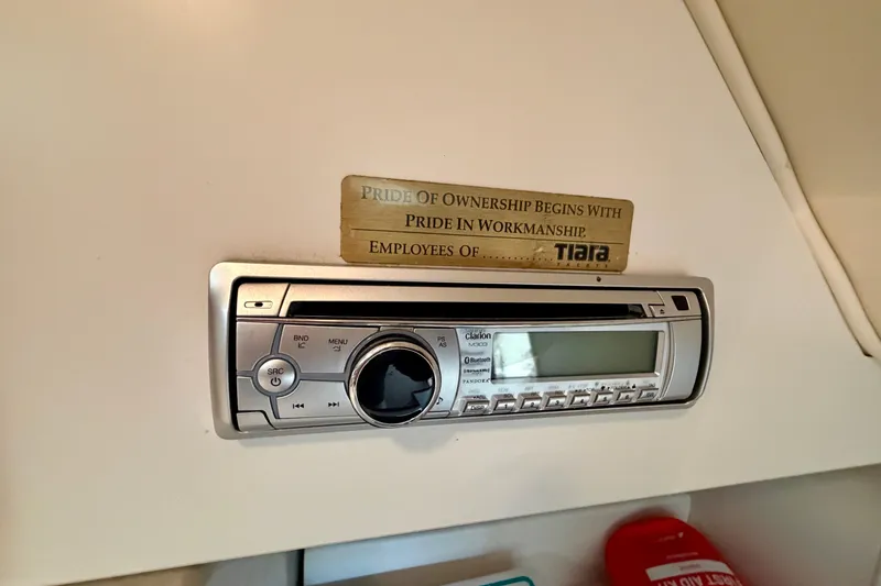 Slide: The Image of Stereo system in a 2000 Tiara Yachts 2900 Coronet with a pride of ownership plaque. - 46