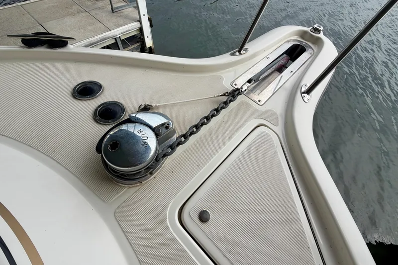 Slide: The Image of Bow of 2000 Tiara Yachts 2900 Coronet with anchor chain and winch. - 9