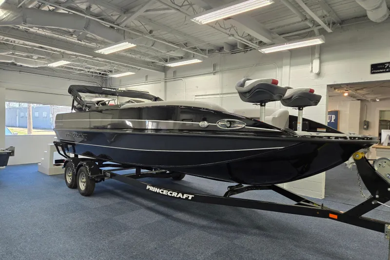 The Image of 2026 Princecraft Ventura 224 boat displayed indoors on a trailer. - 0