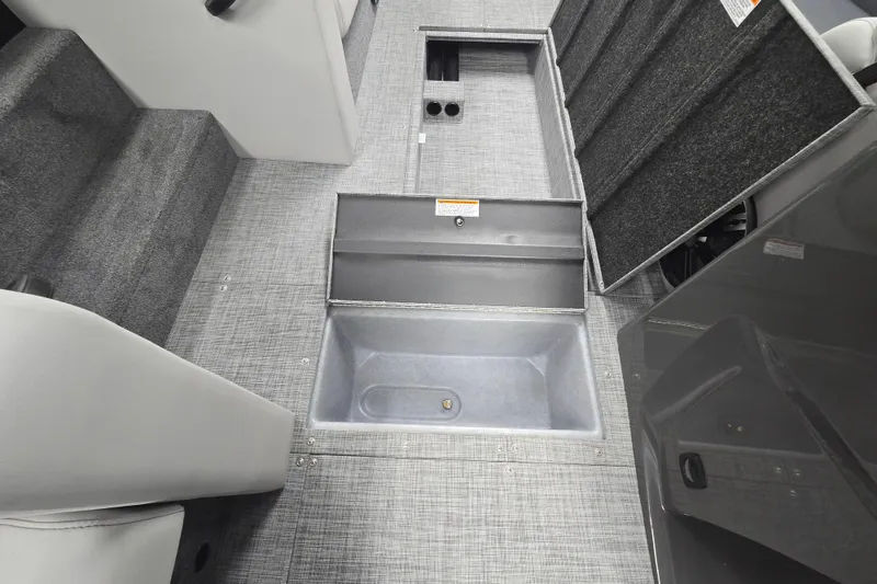 Slide: The Image of Interior view of 2026 Princecraft Ventura 224 boat with open storage compartments. - 10