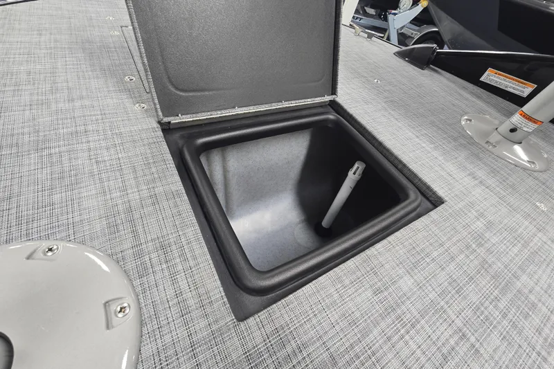 Slide: The Image of Open storage compartment on 2026 Princecraft Ventura 224 boat deck. - 11