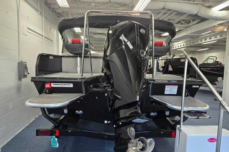 Slide: The Image of 2026 Princecraft Ventura 224 boat with powerful outboard motor in showroom. - 3