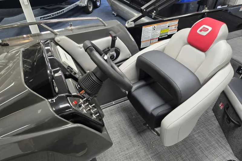Slide: The Image of Captain's seat and helm of 2026 Princecraft Ventura 224 boat, featuring modern controls. - 5