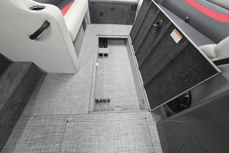 Slide: The Image of 2026 Princecraft Ventura 224 boat interior with open storage compartment and seating. - 9