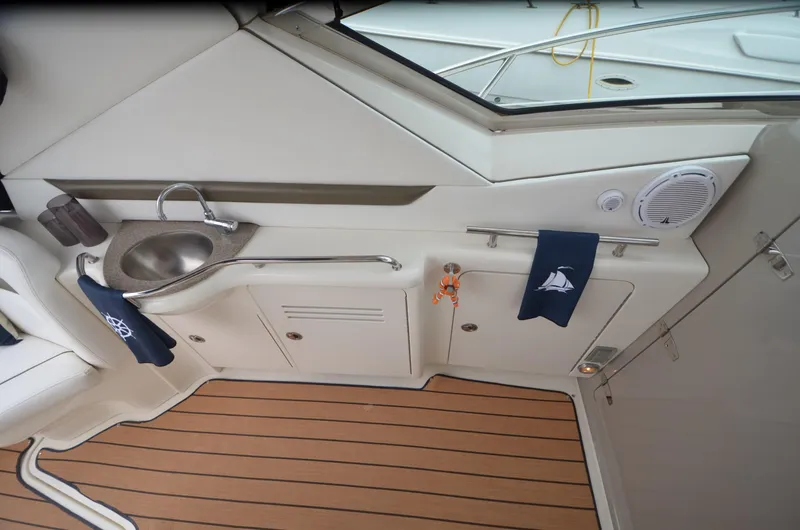 Slide: The Image of Storage compartment of 2007 Sea Ray 38 Sundancer with electrical cables and outlets. - 10