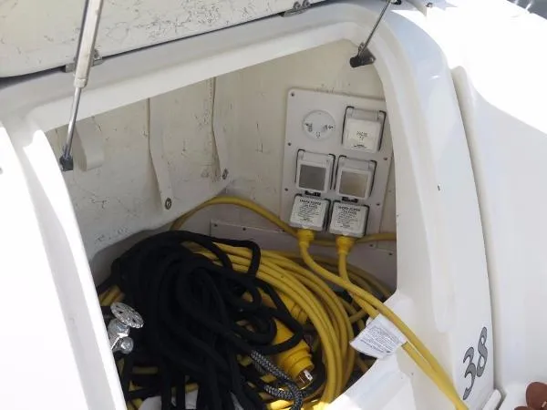 Slide: The Image of Bow view of 2007 Sea Ray 38 Sundancer docked between two piers. - 14