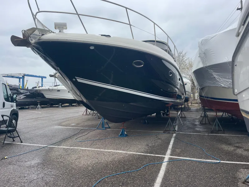 Slide: The Image of Luxurious cabin interior of 2007 Sea Ray 38 Sundancer yacht with cozy bed and porthole windows. - 16