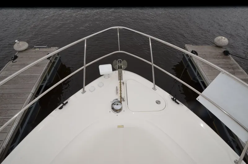 Slide: The Image of 2007 Sea Ray 38 Sundancer interior with kitchen, seating, nautical decor, and cozy cabin. - 18